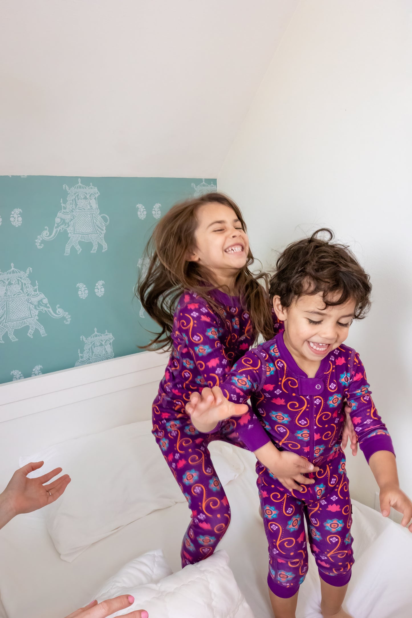 Baby and toddler wearing matching organic cotton South Asian Inspired Diwali sleepwear and pajama set