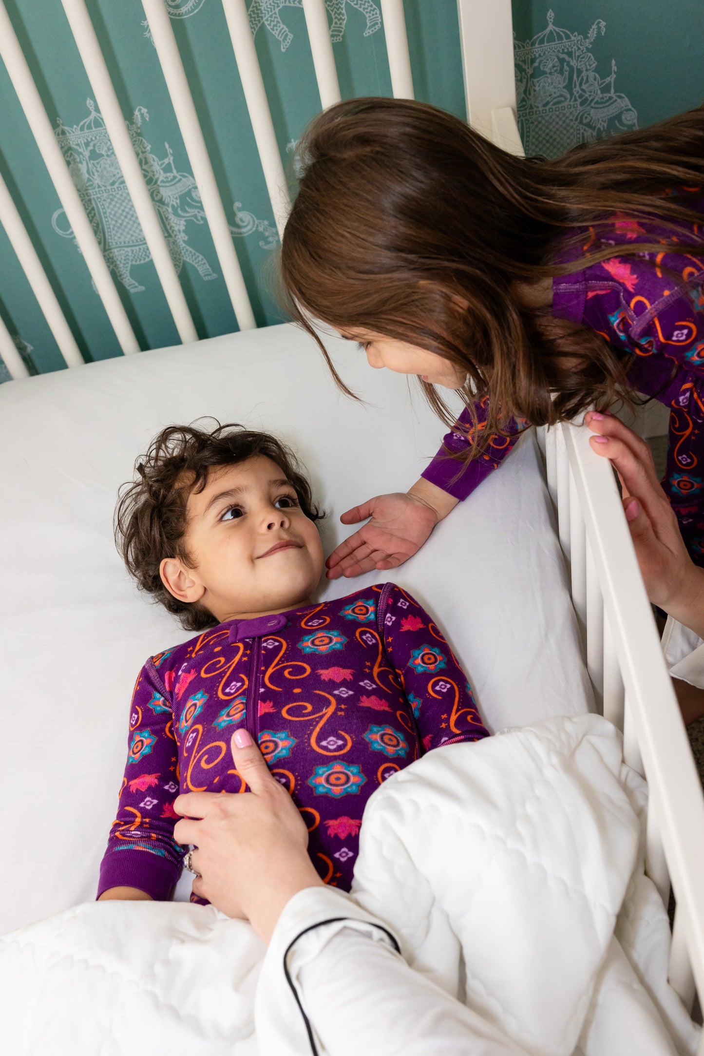 Baby and toddler wearing matching organic cotton South Asian Inspired Diwali sleepwear and pajama set